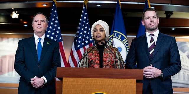 Reps. Adam Schiff, D-Calif., Ilhan Omar, D-Minn., and Eric Swalwell, D-Calif., conduct a news conference about being removed from committee assignments Jan. 25, 2023.