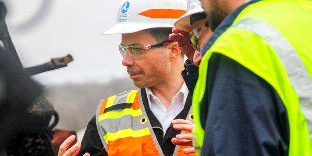 Transportation Secretary Pete Buttigieg tours the site of the Feb. 3, Norfolk Southern train derailment, Thursday, Feb. 23, 2023, in East Palestine, Ohio.